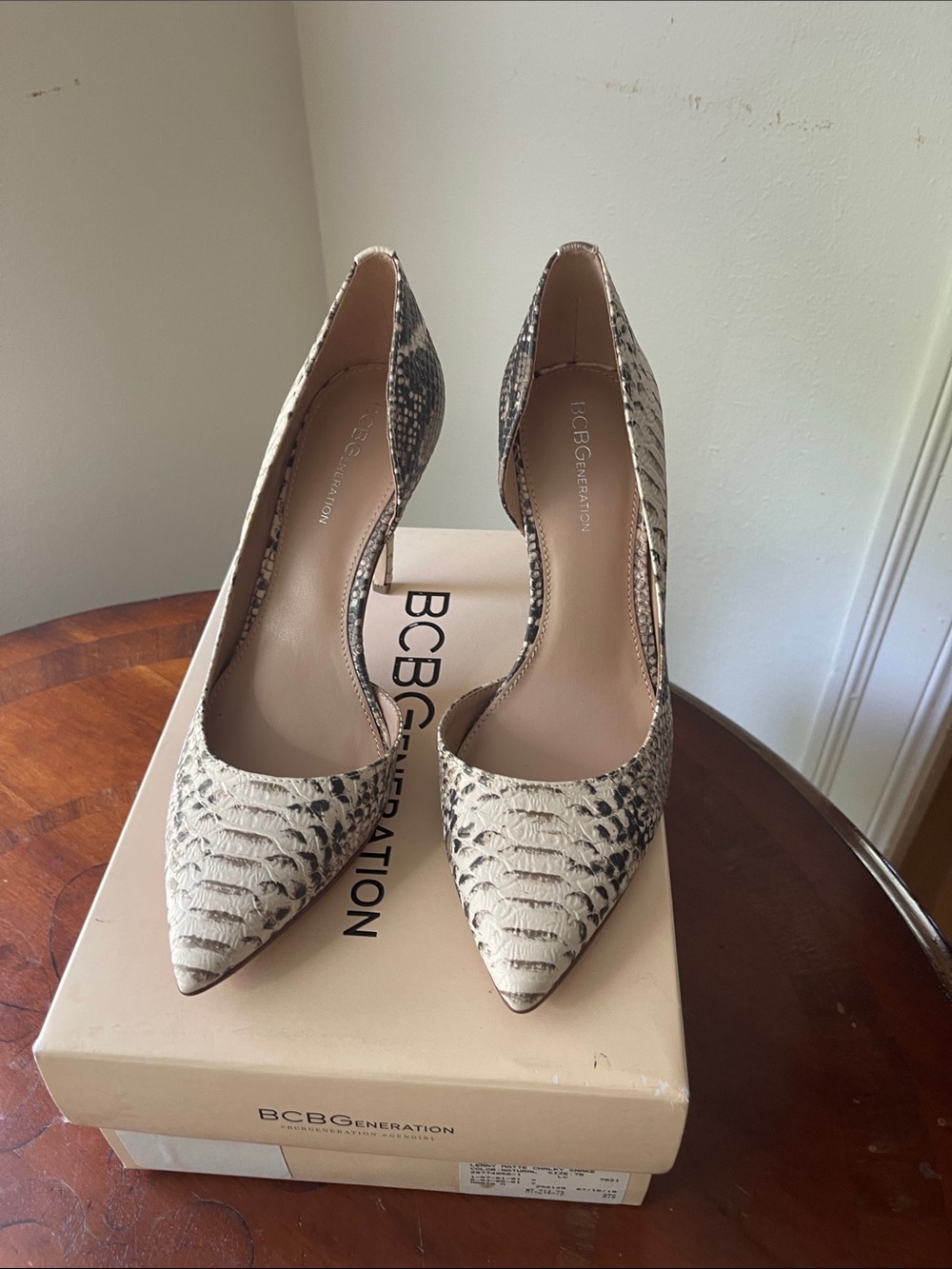 BCBGeneration Snake-Print Pointed Toe Pumps in Beige and Black